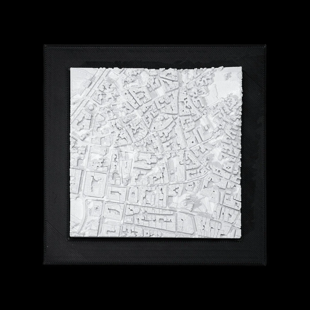 Framed Athens city relief map showing raised buildings and terrain.