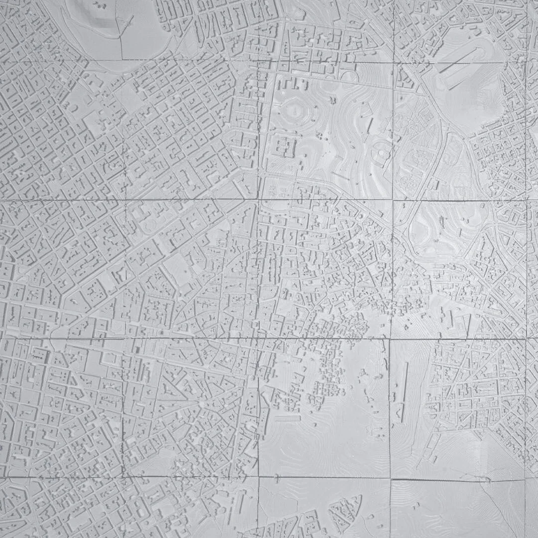 Overhead view of an Athens relief map showing streets and terrain contours.