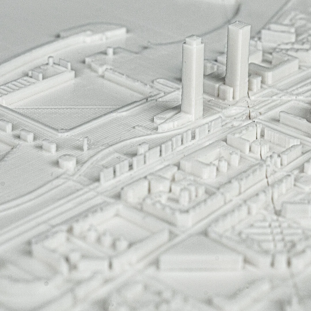 Close angled view of raised towers in a Barcelona city relief map.