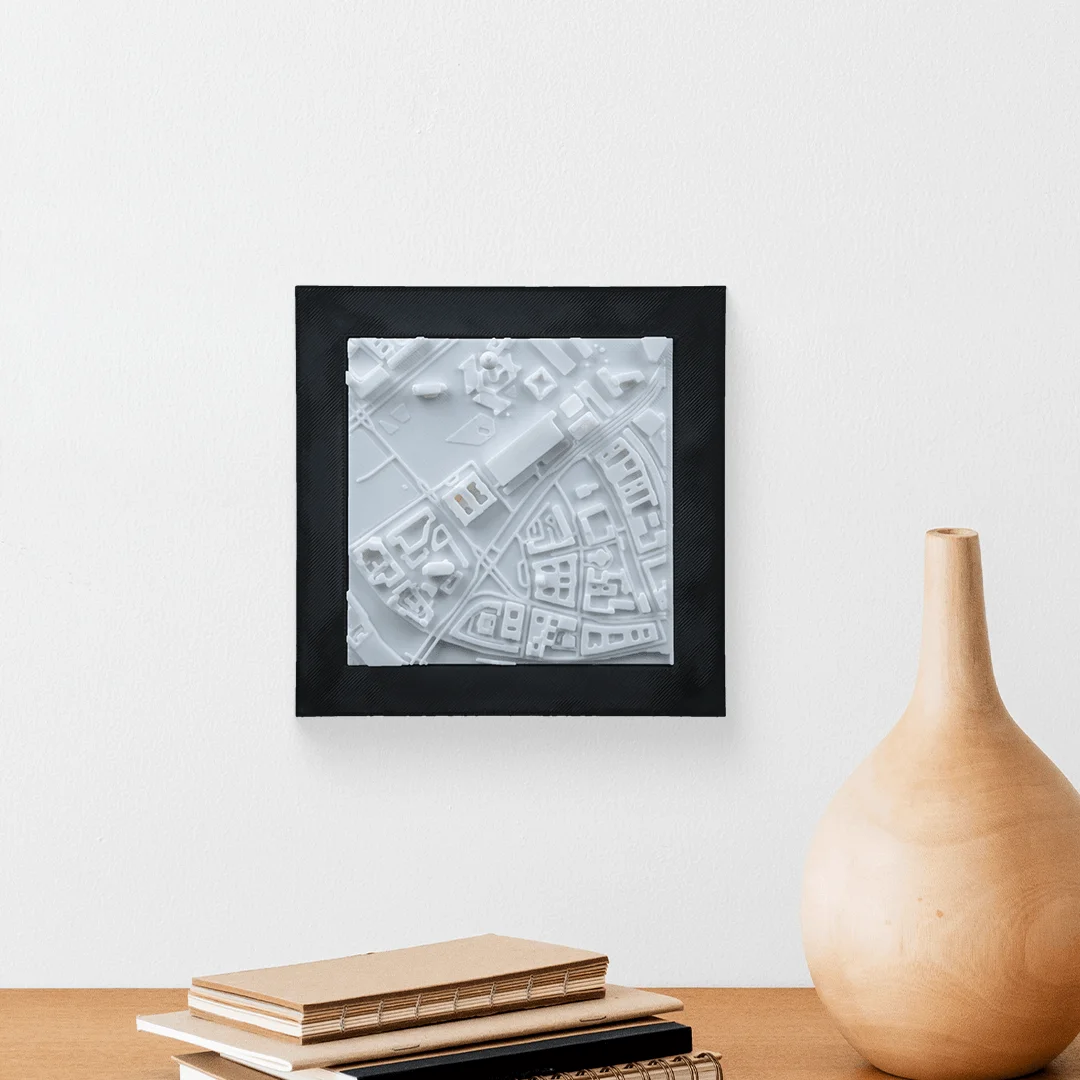 Framed Berlin city relief map displayed on a wall.