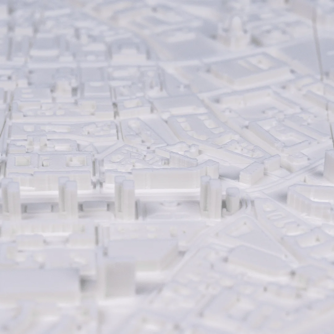 Close view of raised landmark buildings in a Berlin city relief map.