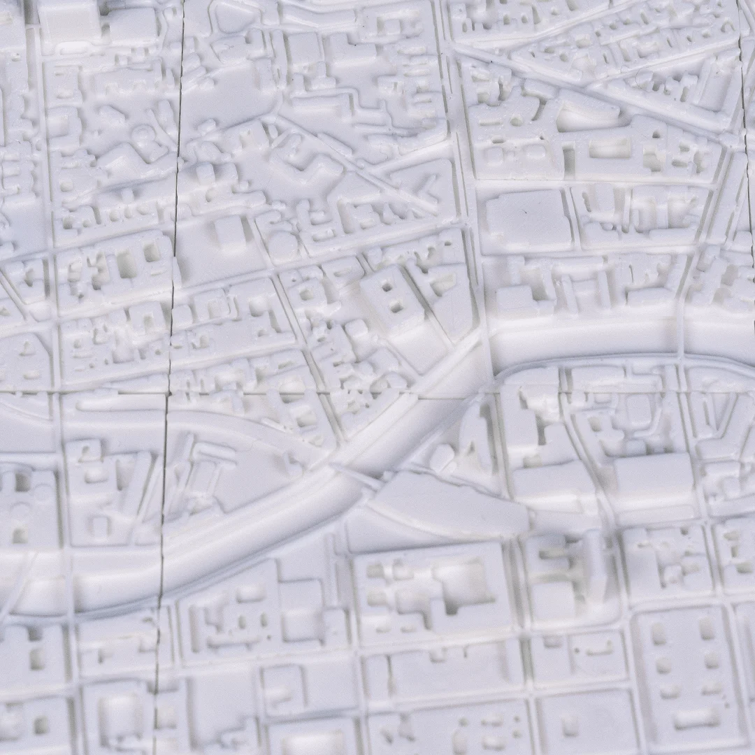 Overhead detail of a Berlin relief map showing streets and waterways.