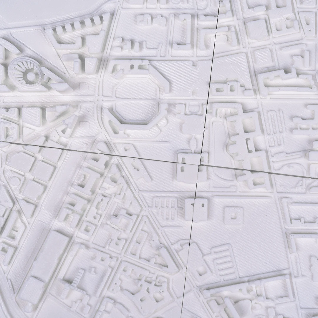 Close overhead view of a Berlin city relief map and its urban layout.