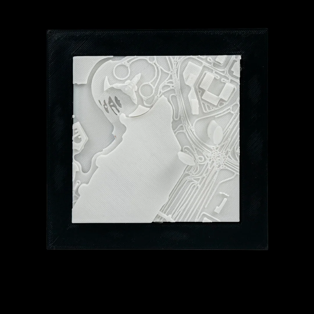Front view of a framed Dubai city relief map.
