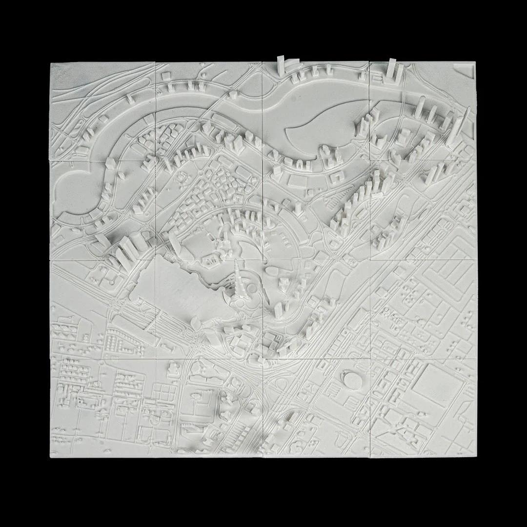 Full view of a Dubai city relief map showing buildings and road networks.