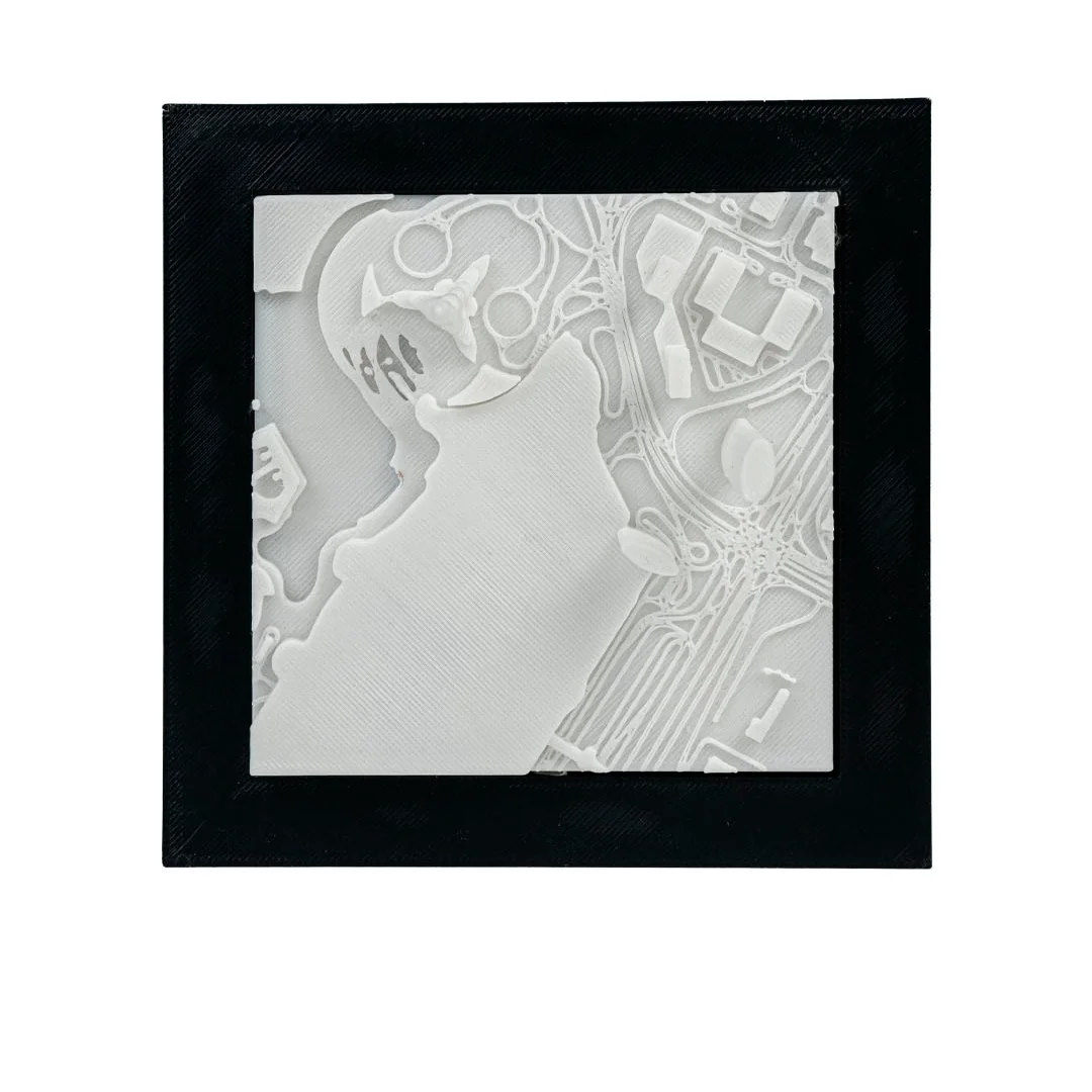 Close front view of a framed Dubai city relief map.