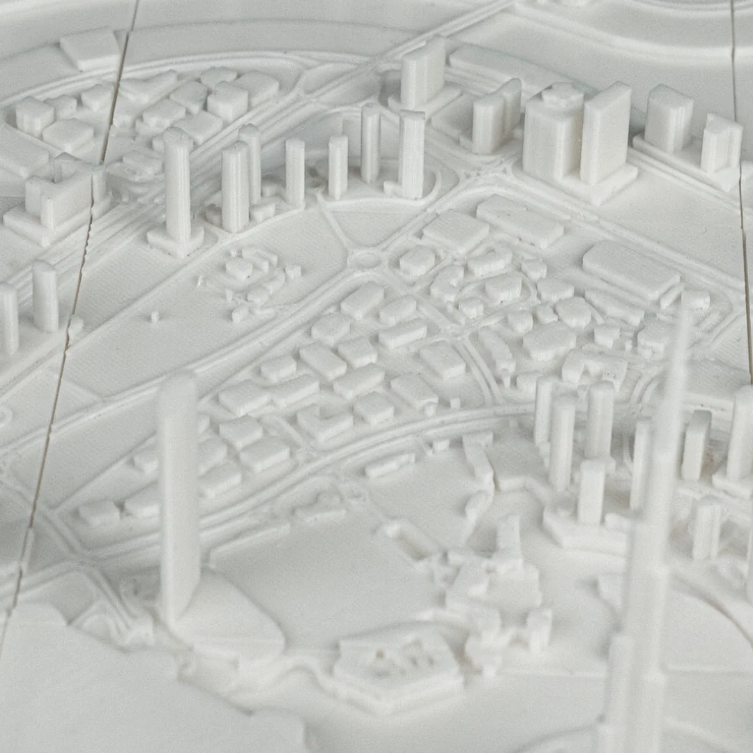 Close view of raised building forms in a Dubai city relief map.