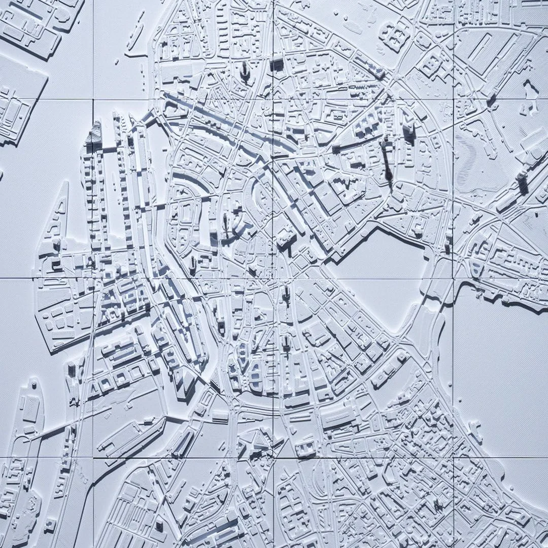 Close overhead view of streets and canals in a Hamburg city relief map.