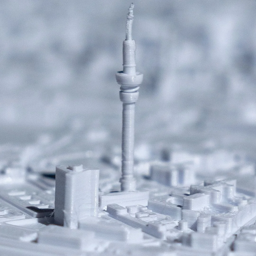 Close view of a slender tower in a Hamburg city relief map.