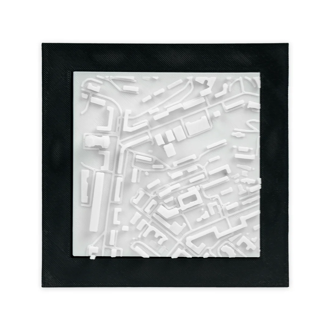 Close front view of a framed Kyiv city relief map.