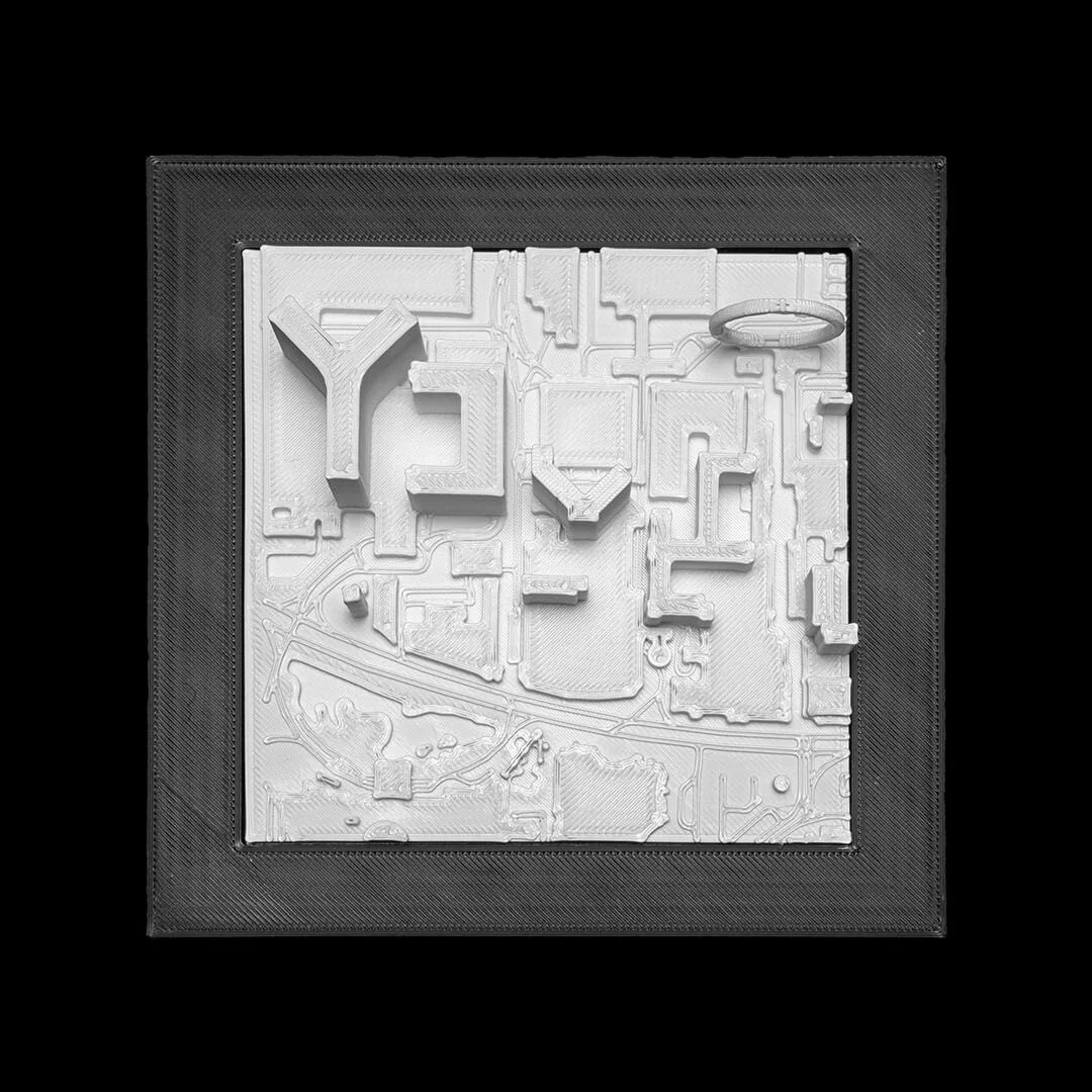 Framed Las Vegas city relief map showing raised hotel-shaped buildings.