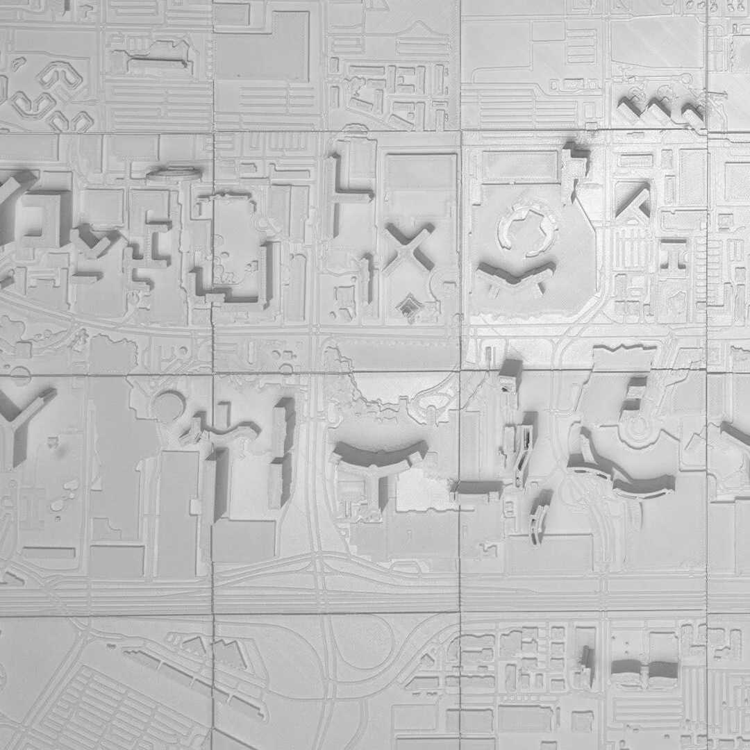 Overhead detail of buildings and roads in a Las Vegas city relief map.