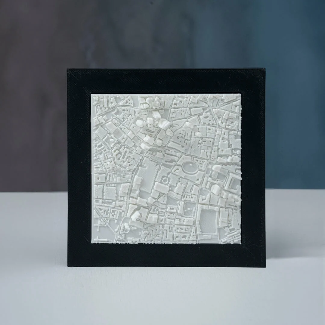 Front view of a framed London city relief map.