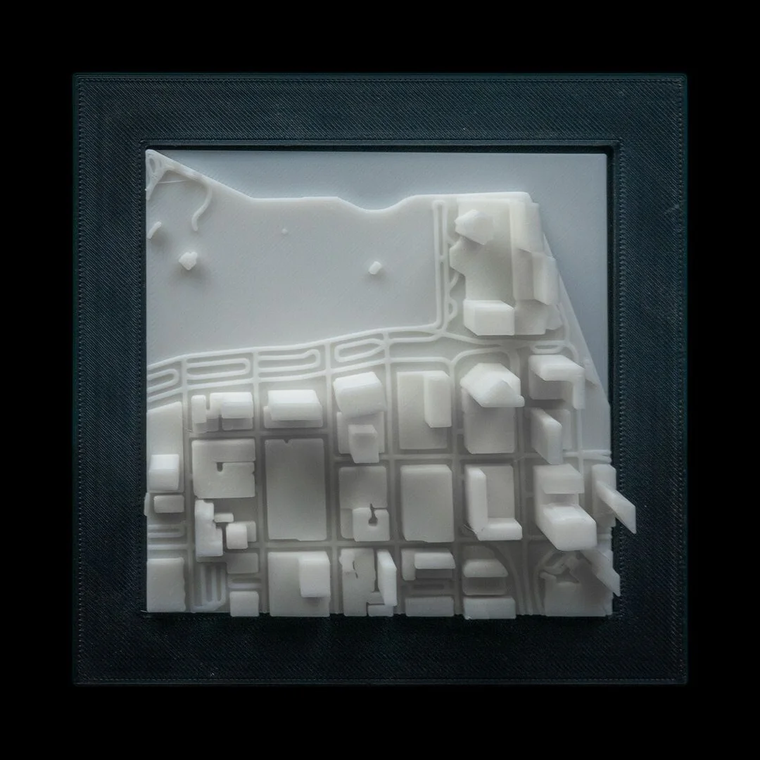 Front view of a framed Miami city relief map.