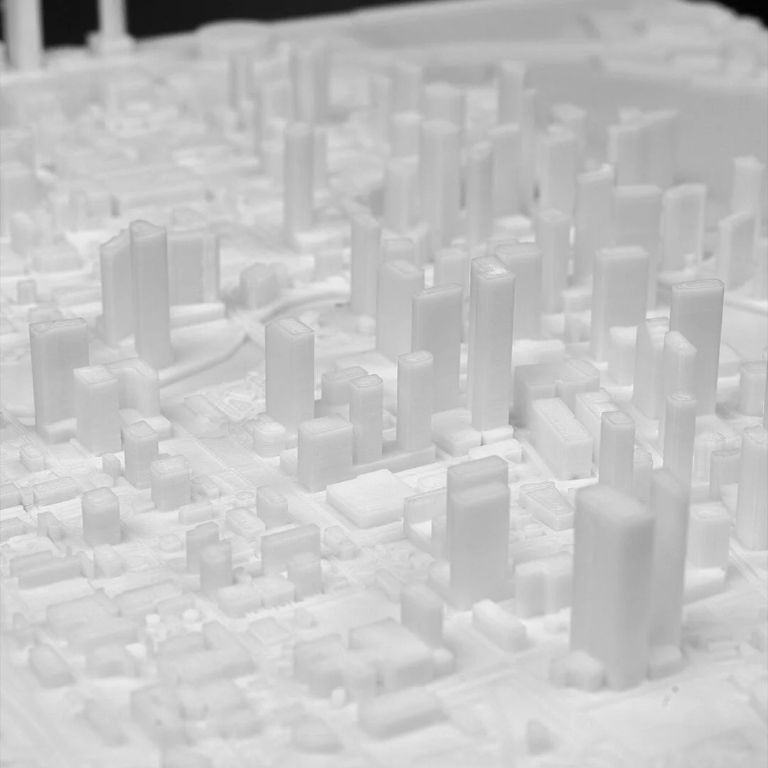 Angled close view of raised towers in a Miami city relief map.