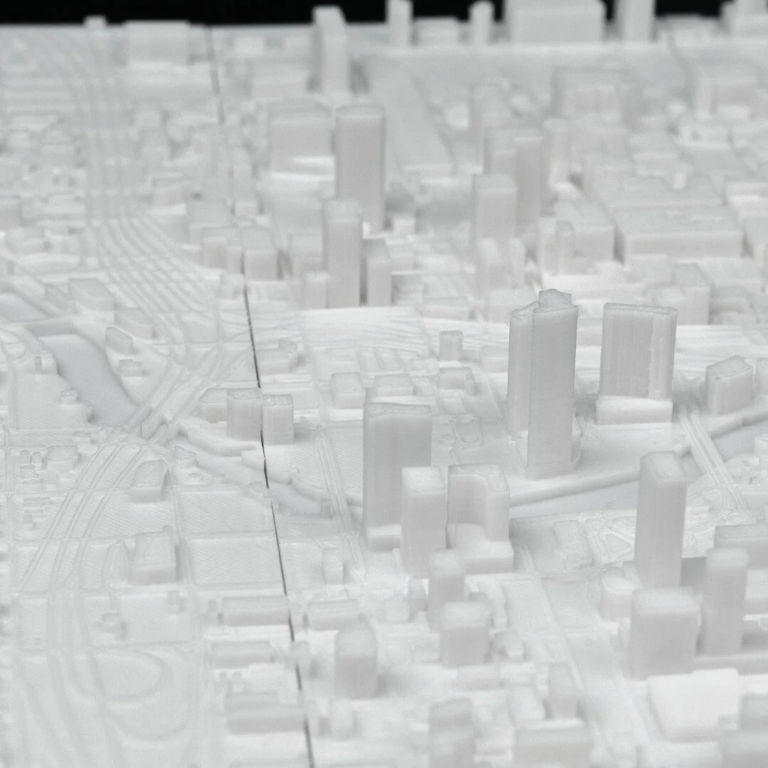 Low view across street blocks in a Miami city relief map.