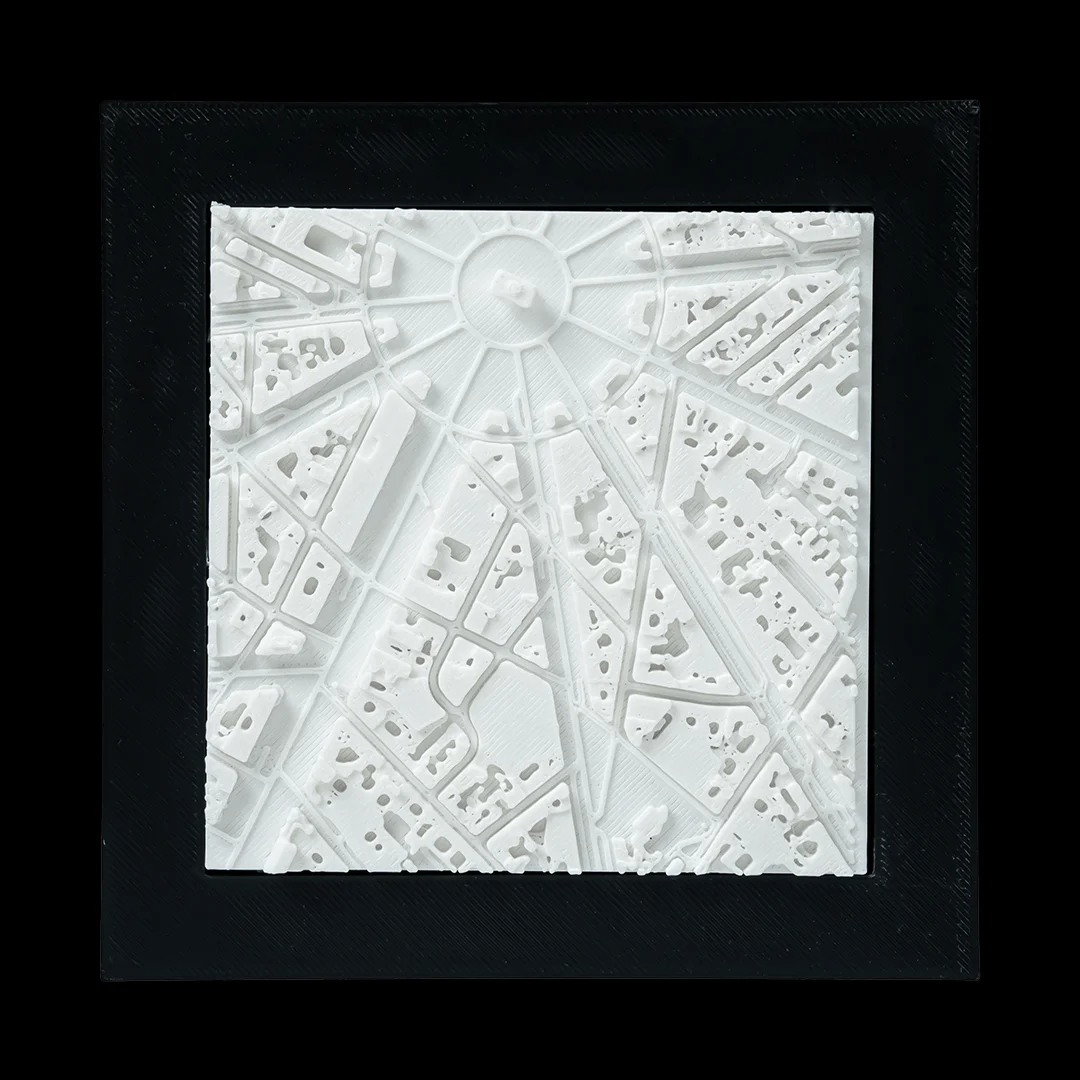 Framed Paris city relief map showing streets radiating from a circular junction.