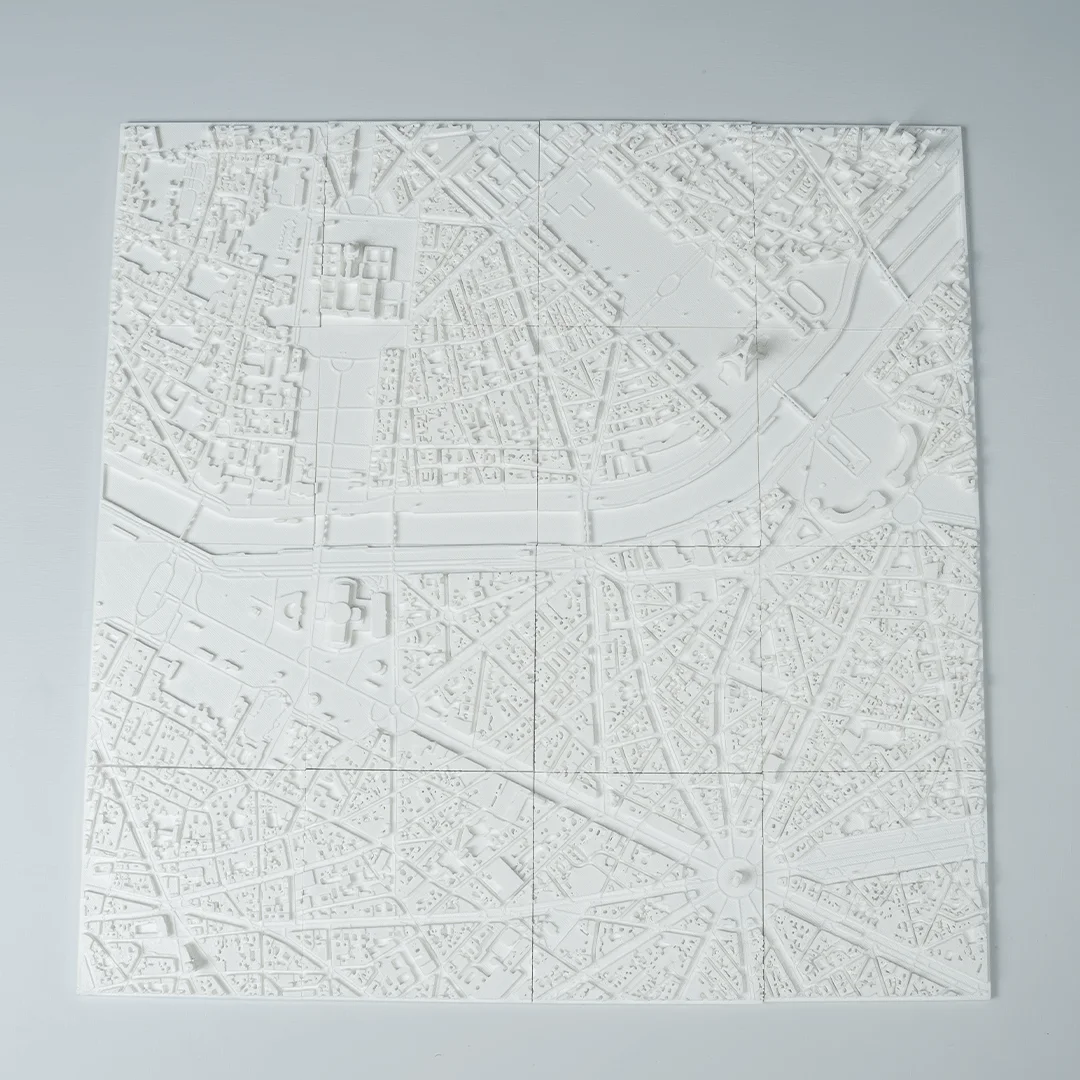 Full view of a Paris city relief map showing the river and street network.