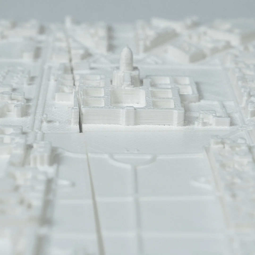 Low angled detail of buildings and open spaces in a Paris city relief map.