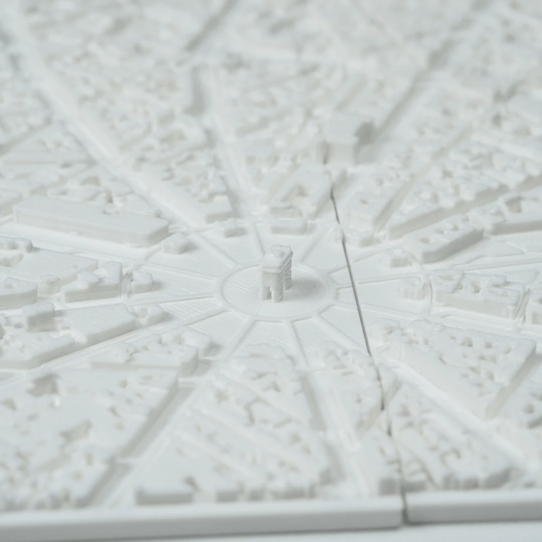 Angled detail of radiating avenues in a Paris city relief map.