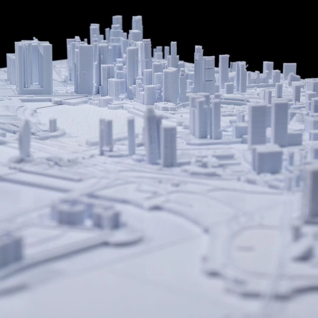Low view across waterfront buildings in a Singapore city relief map.