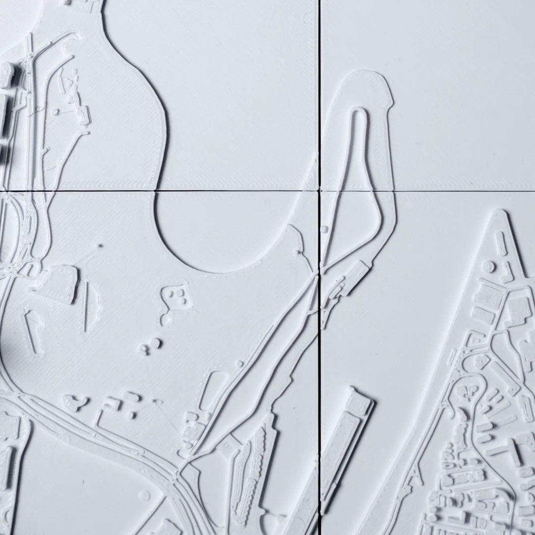 Overhead detail of the harbour bridge in a Sydney city relief map.