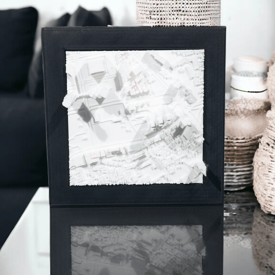 Framed Tokyo city relief map on a tabletop.