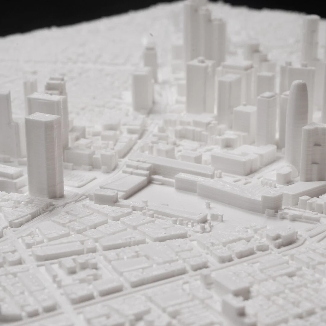 Close view of towers and street blocks in a Tokyo city relief map.