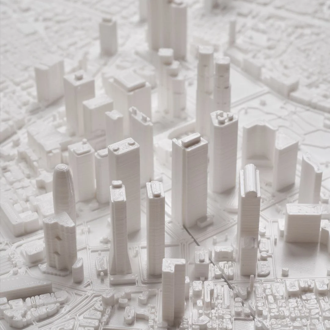 Elevated detail of tall buildings in a Tokyo city relief map.