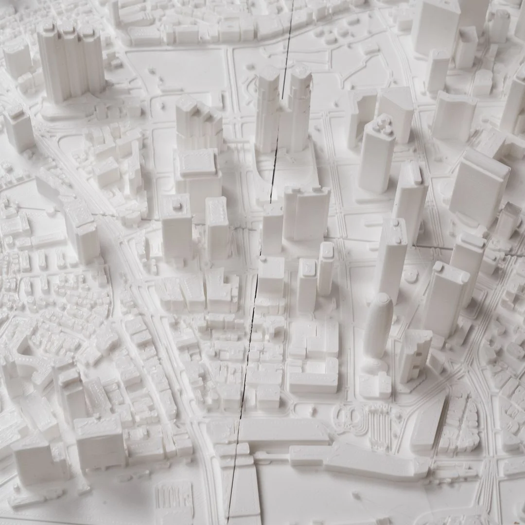 Overhead detail of urban buildings and roads in a Tokyo city relief map.