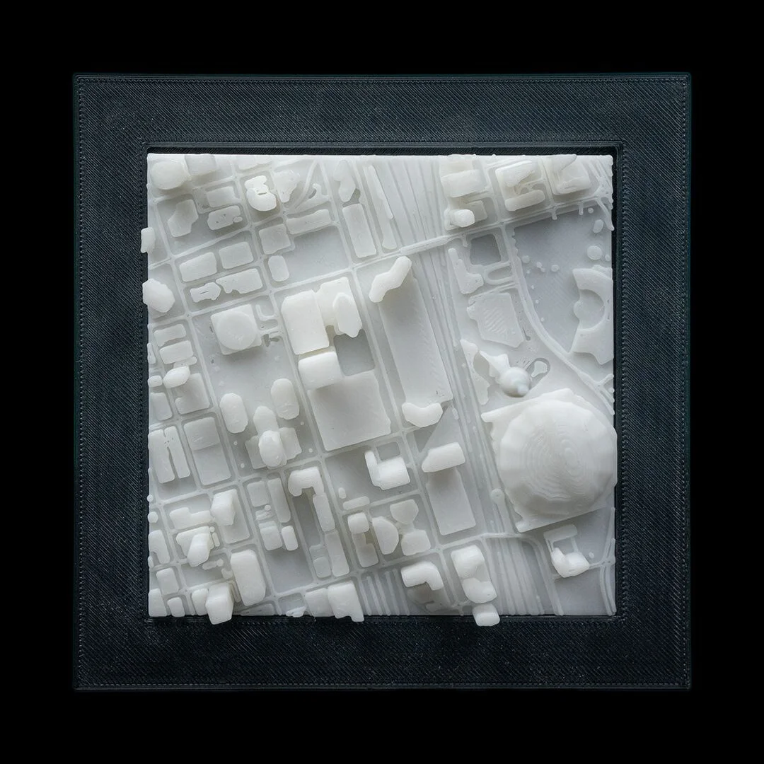Front view of a framed Toronto city relief map.