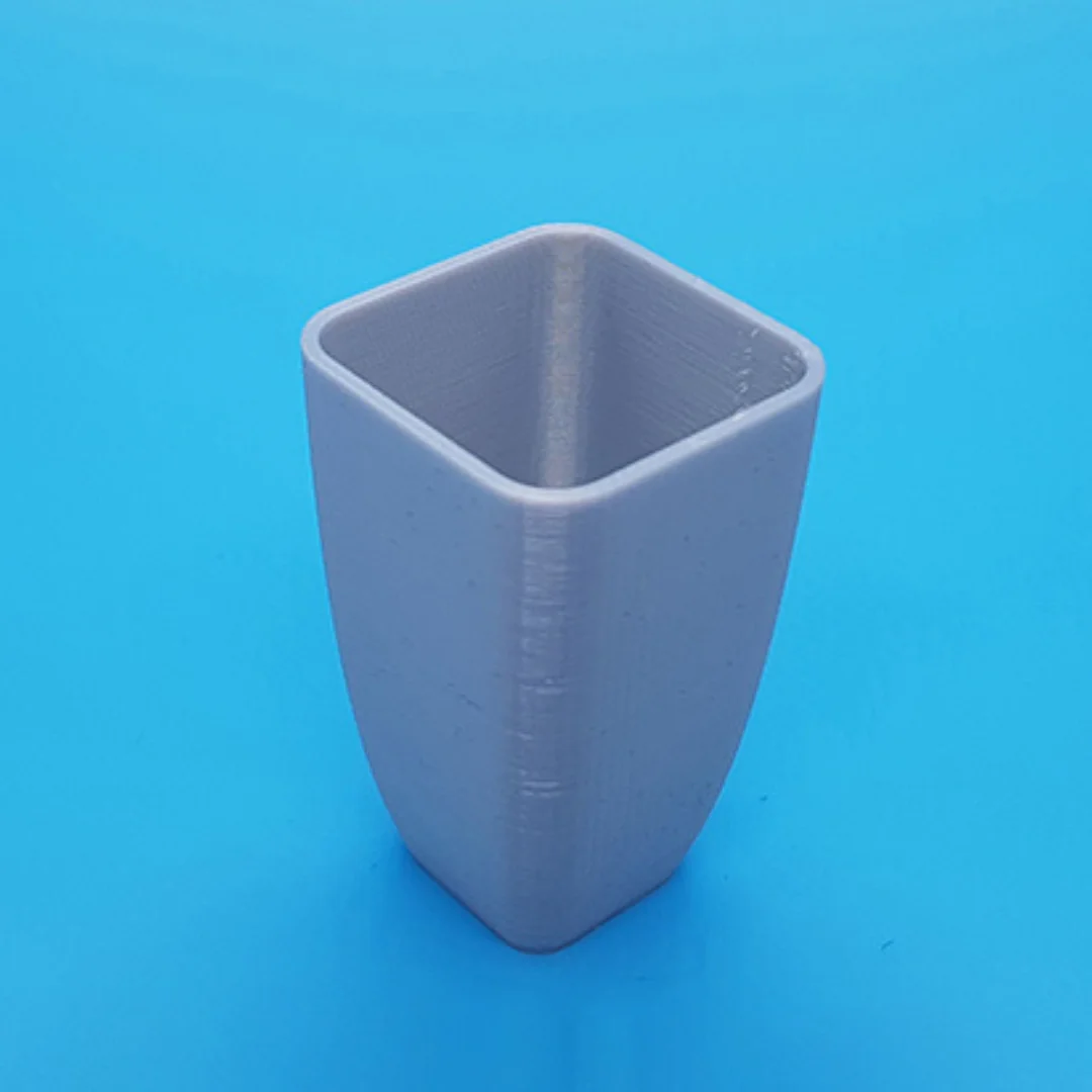 Rigid Vase showing its open rim and 3D printed surface.