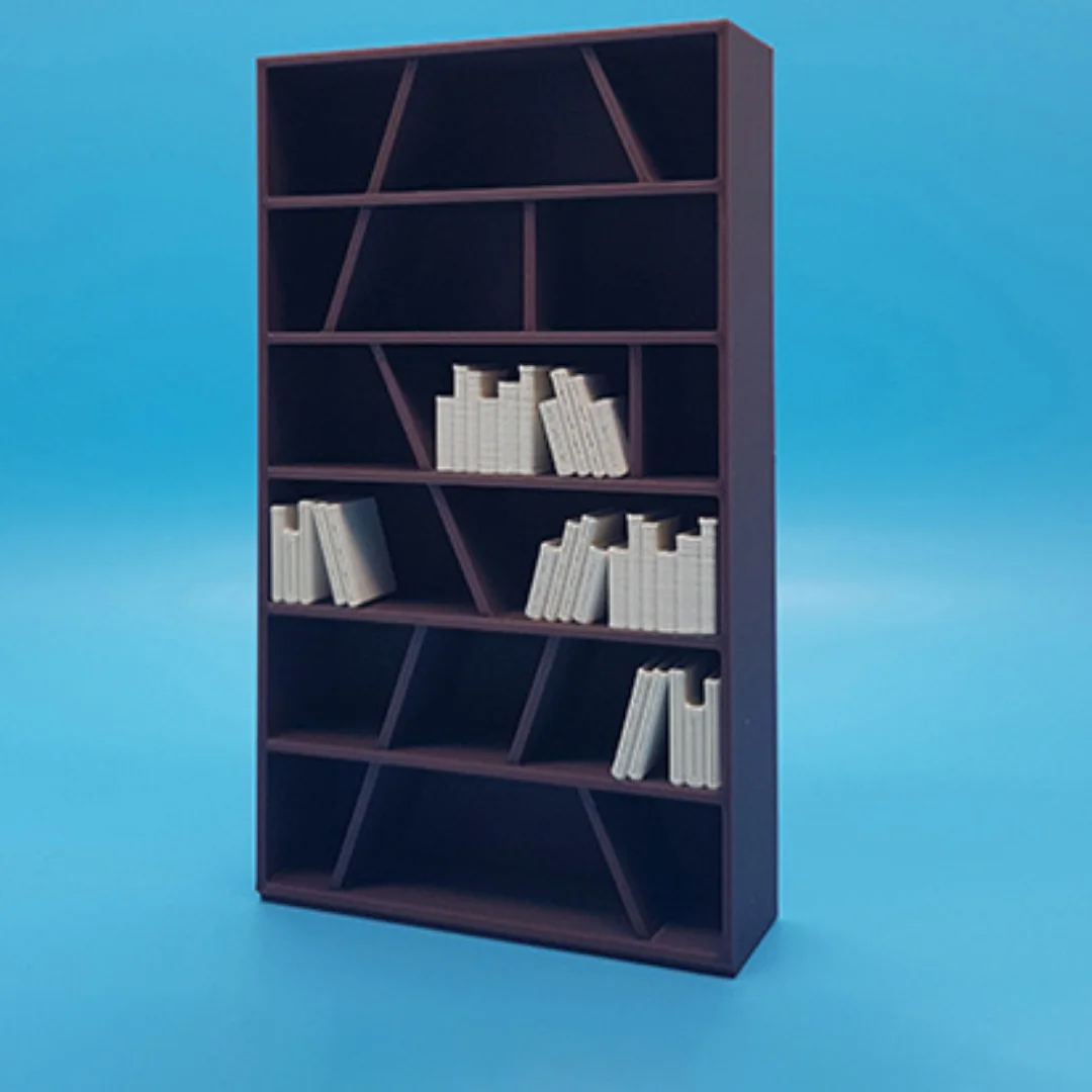 Miniature books arranged on model shelving to illustrate their use in an interior scene.