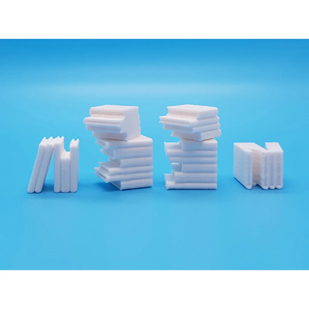 Miniature books arranged in groups for a 1:20 scale model.