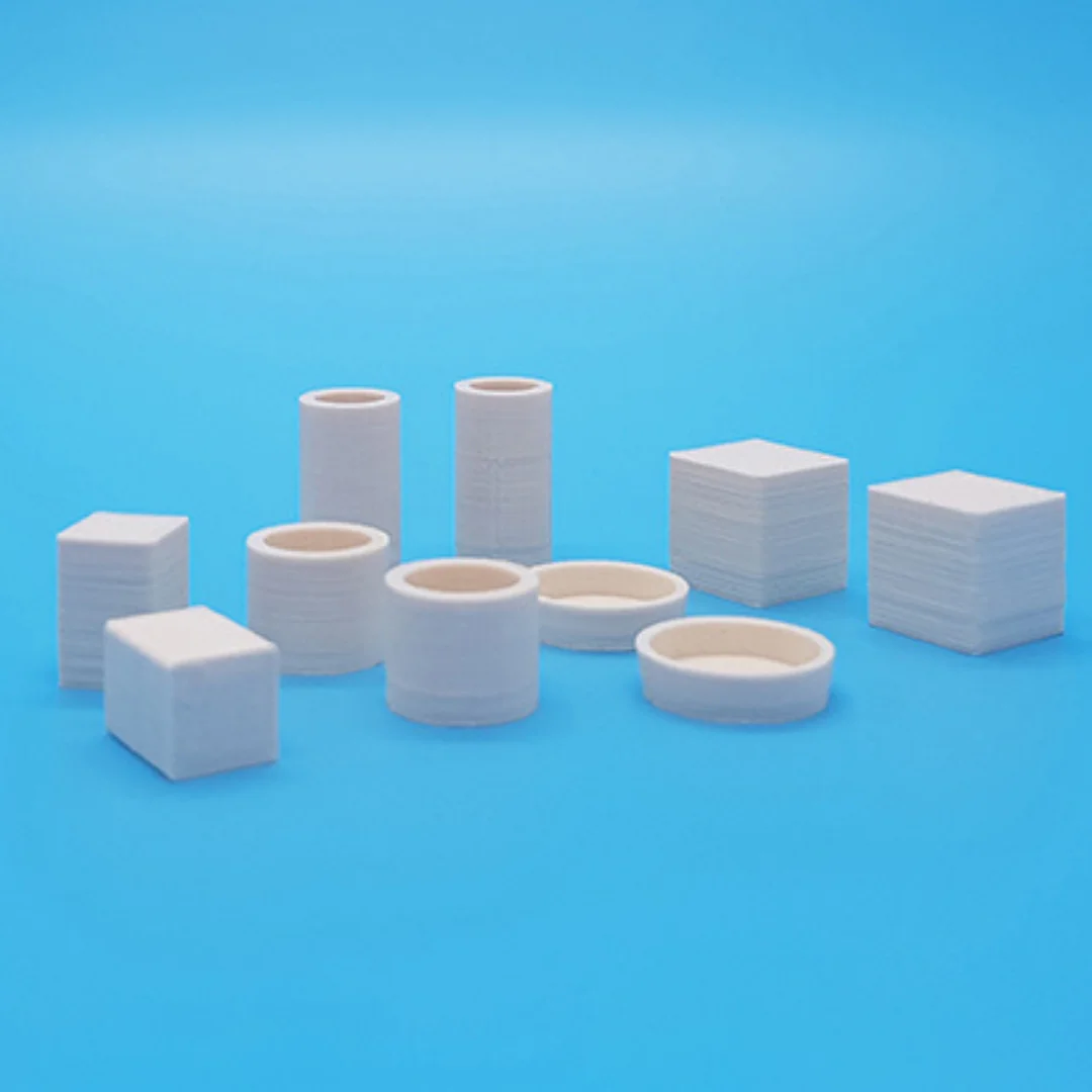 Miniature vases and boxes at 1:20 scale arranged to show their different shapes.