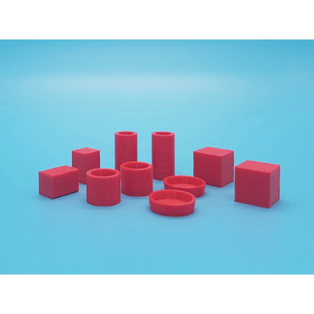 Miniature vases and boxes at 1:20 scale arranged to show their different shapes.