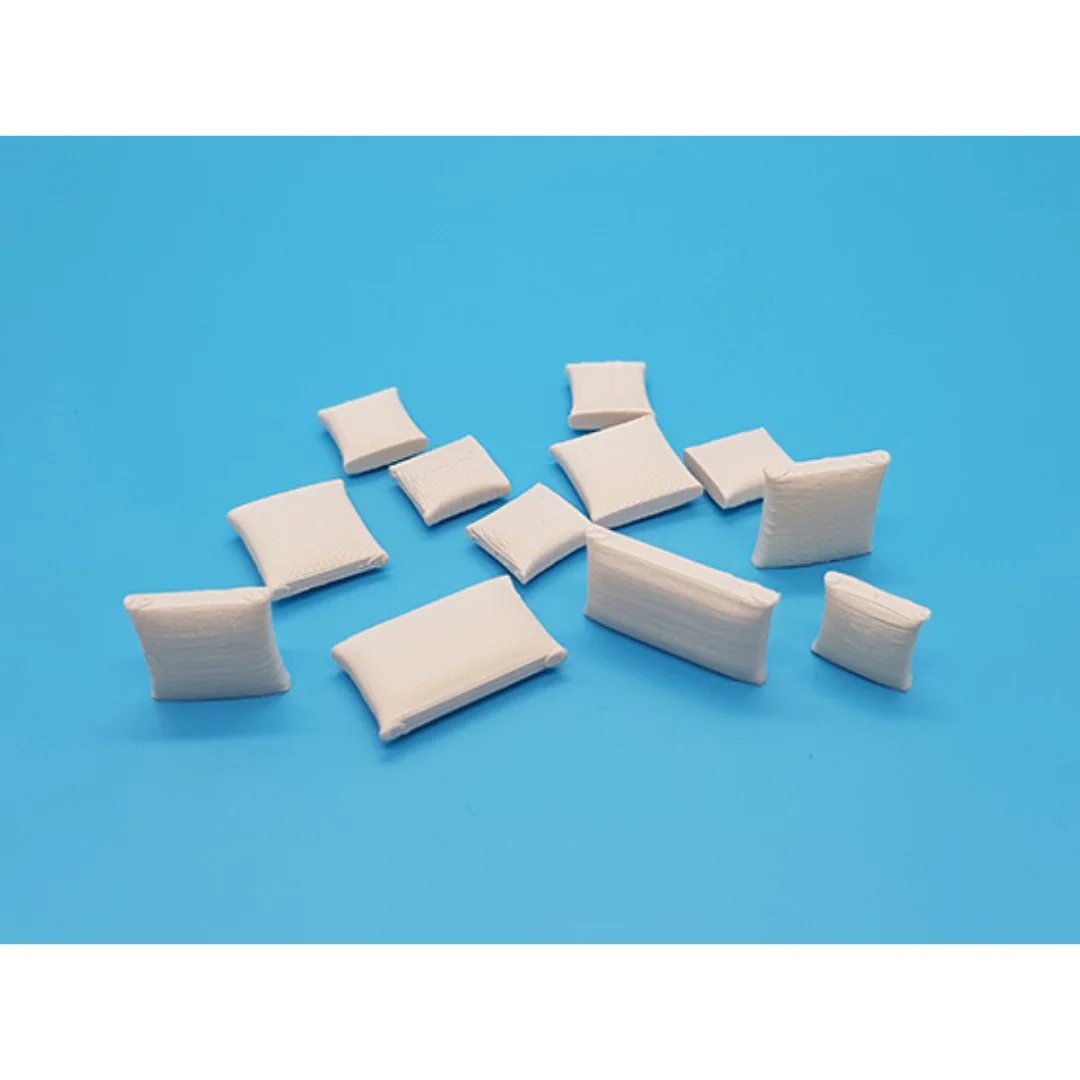 Miniature cushions at 1:50 scale arranged to show their different shapes.
