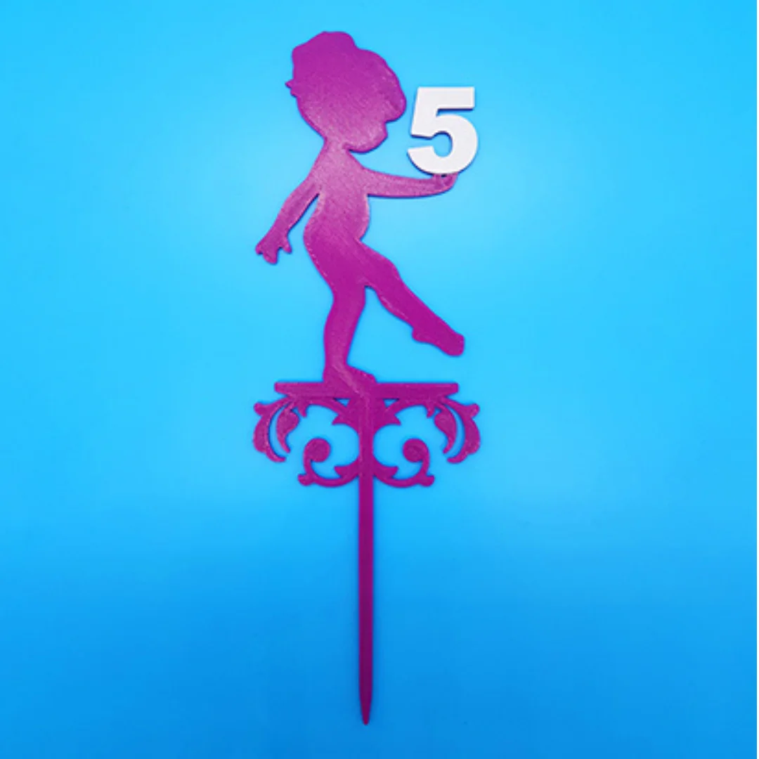 3D printed birthday cake topper with a child silhouette holding the number 5 and decorative scrollwork.