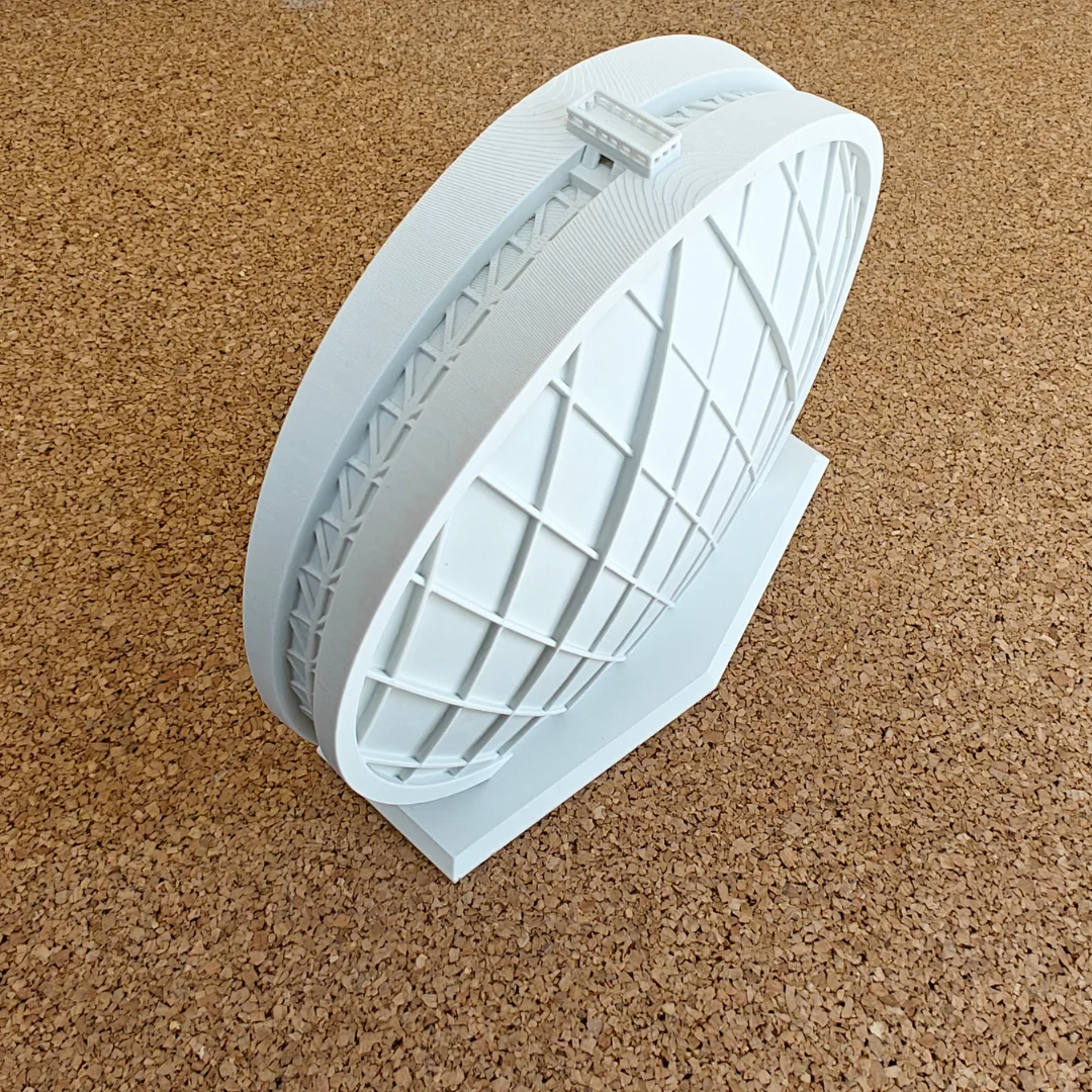 Top angled view of an Aldar Headquarters model showing the roof and circular facade.