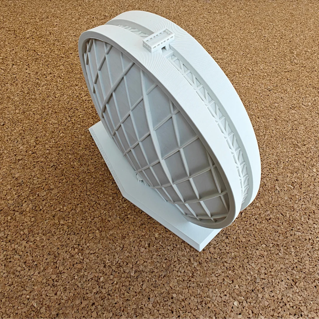 Elevated side view of an Aldar Headquarters model showing the depth of the building.