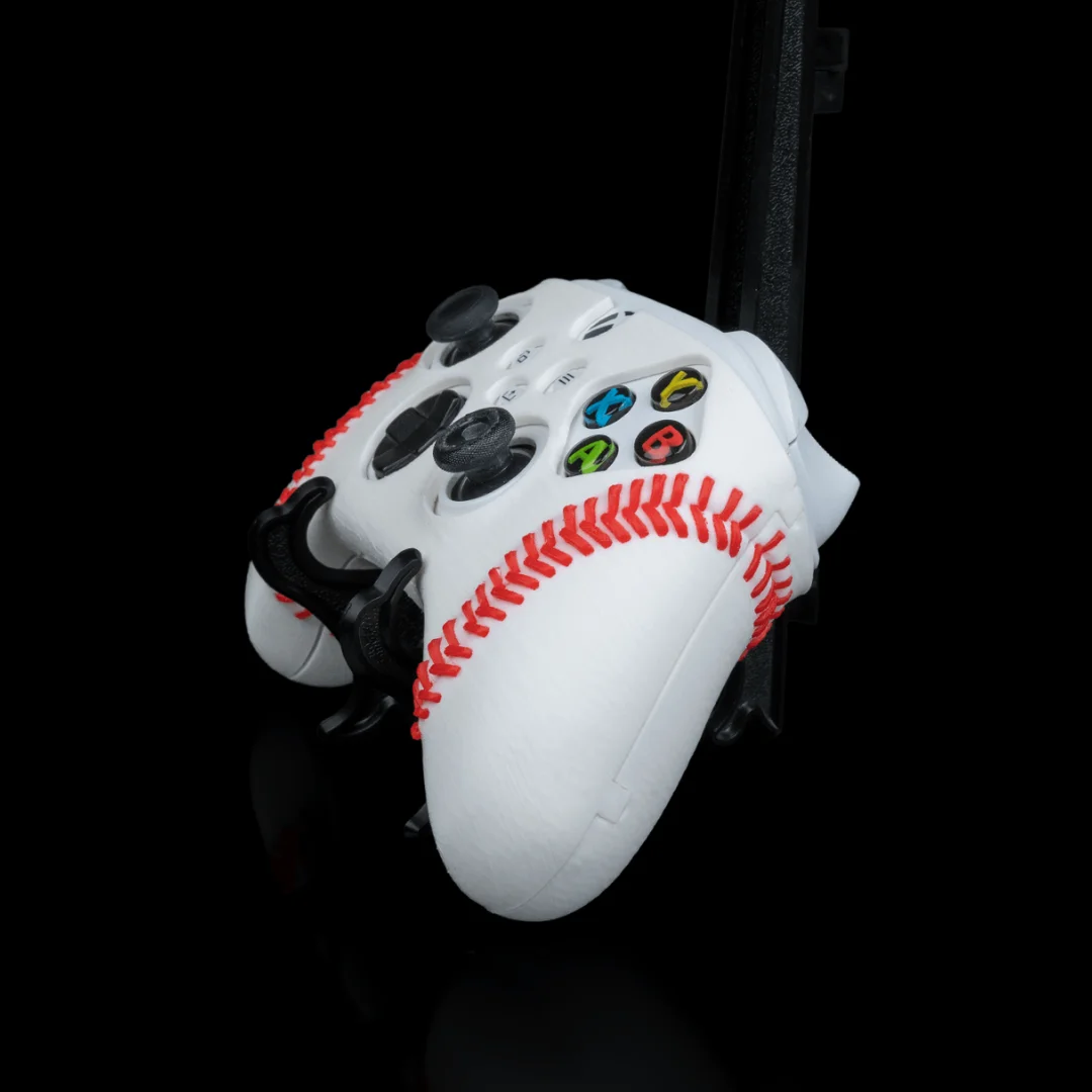Angled view of a baseball-style cover fitted to an Xbox controller.