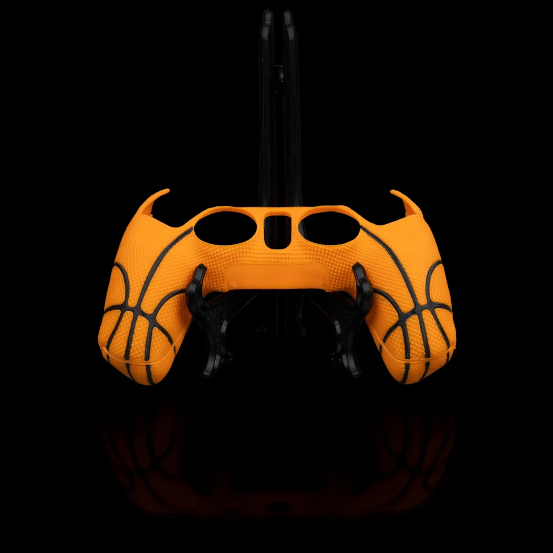 Basketball-style PS5 controller cover with textured grips and openings for controls.