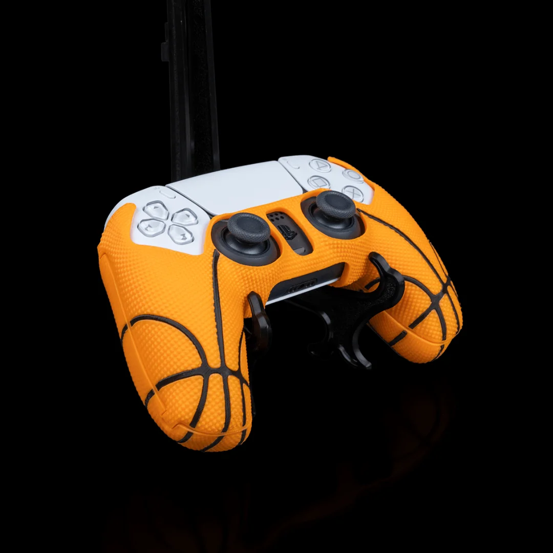 Angled front view of a basketball-style cover fitted to a PS5 controller.