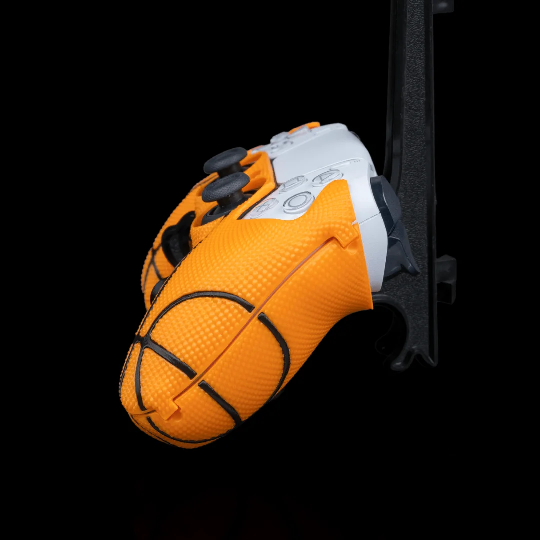 Side detail of a basketball PS5 controller cover showing its textured grip.