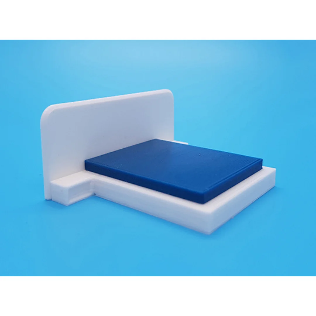 Aurora miniature bed at 1:50 scale, showing its headboard, mattress and base.