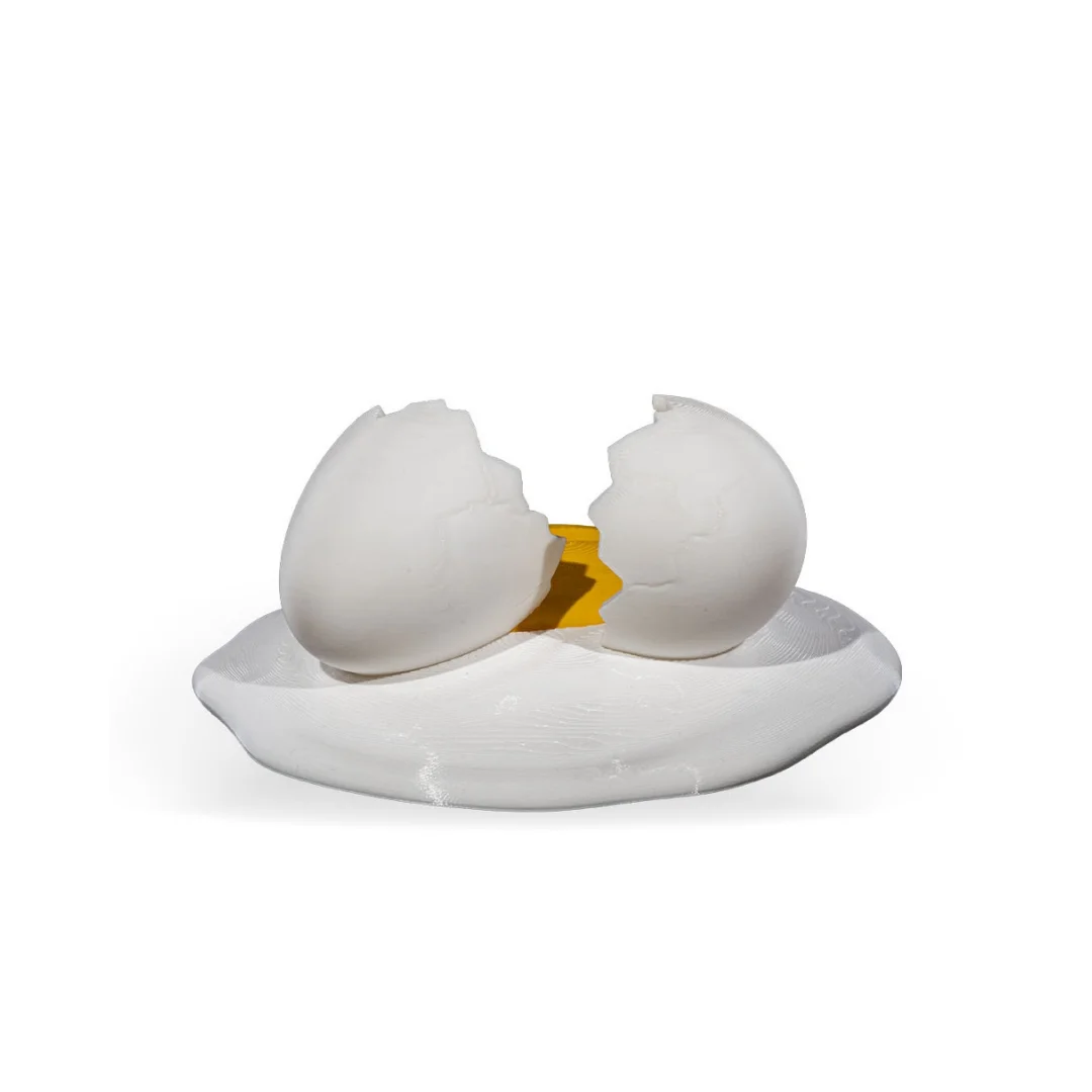 Side rear view of a broken egg phone holder.