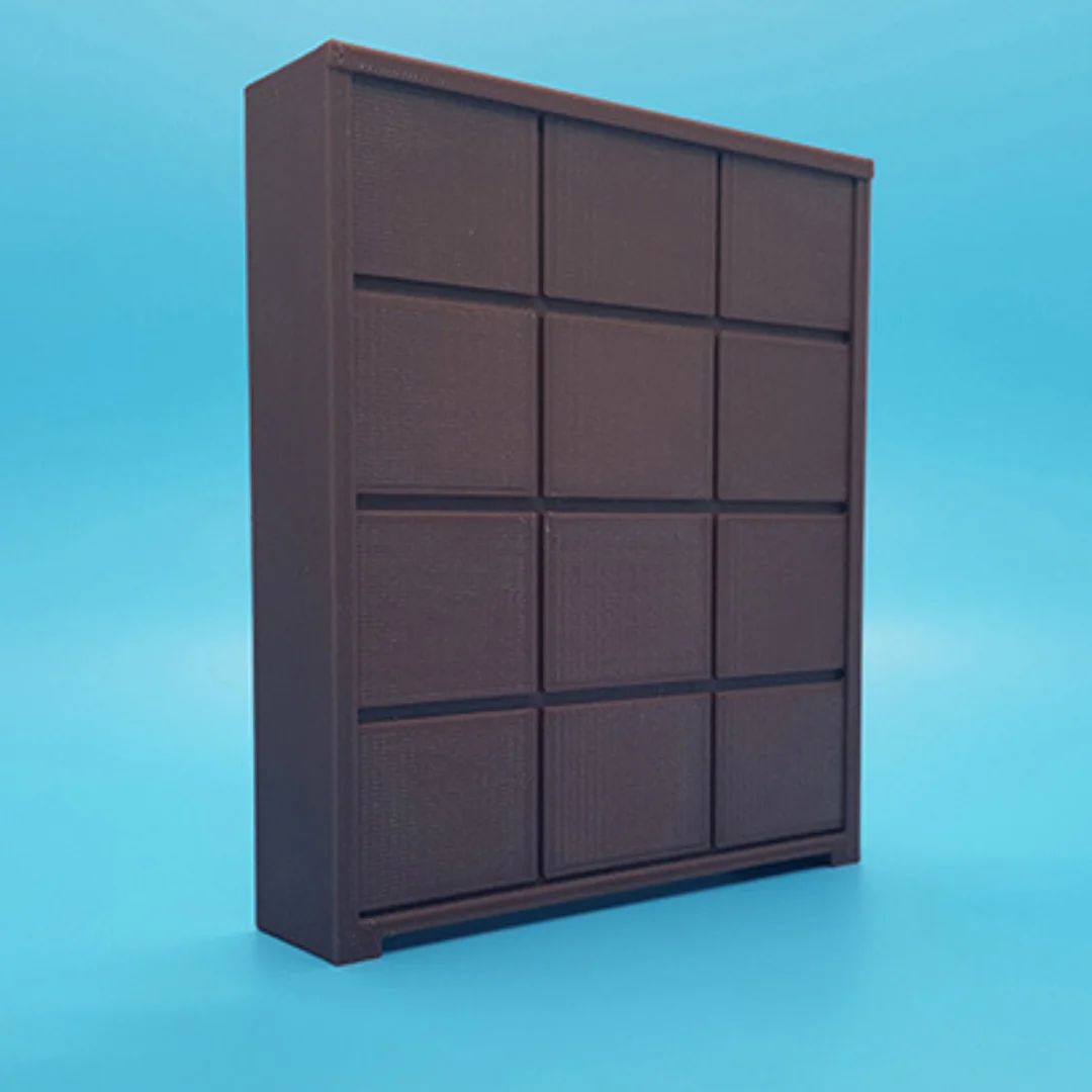 Angled view of the Elegant-1 miniature cabinet at 1:20 scale, showing its panelled front and frame.