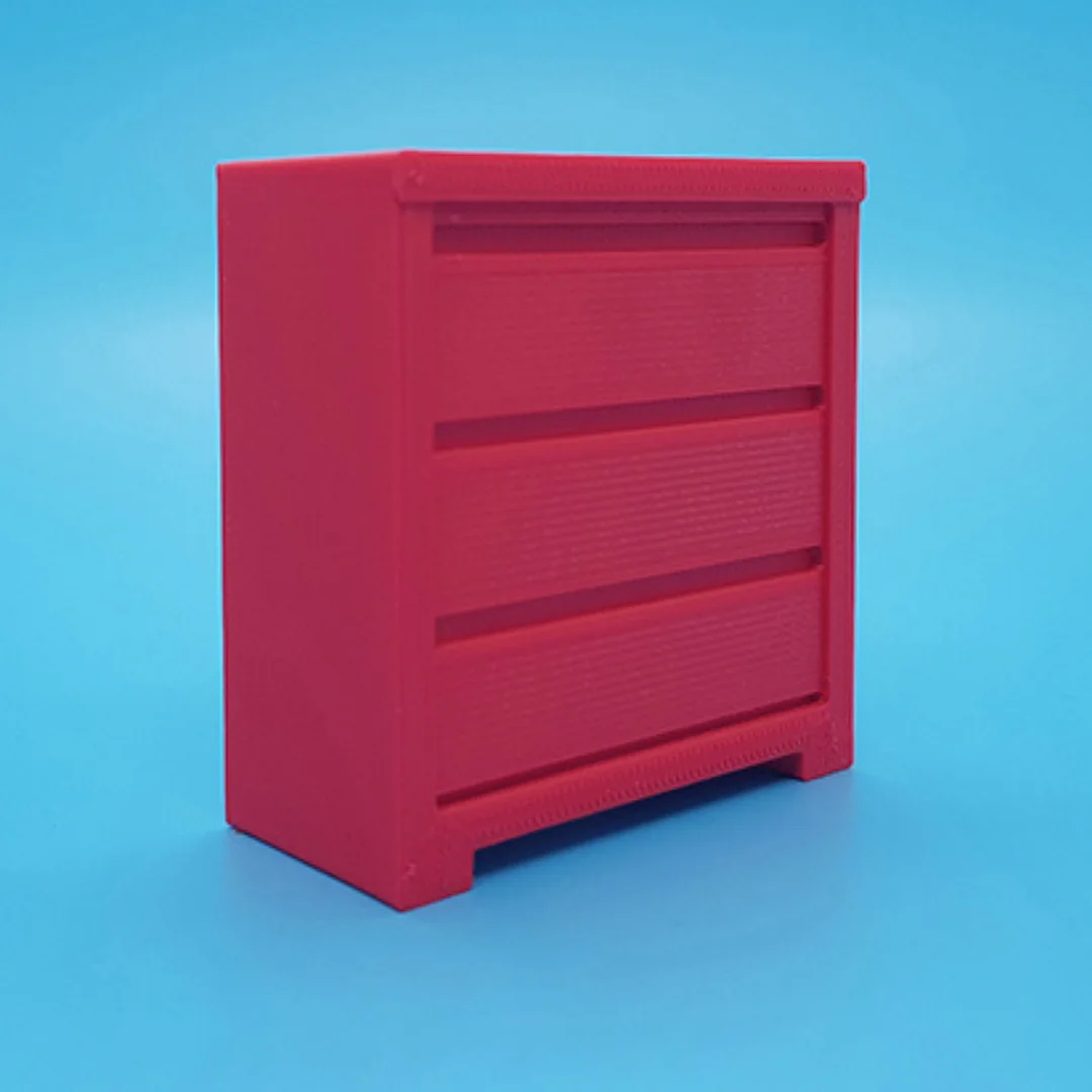 Angled view of the Elegant-6 miniature cabinet at 1:20 scale, showing its panelled front and frame.