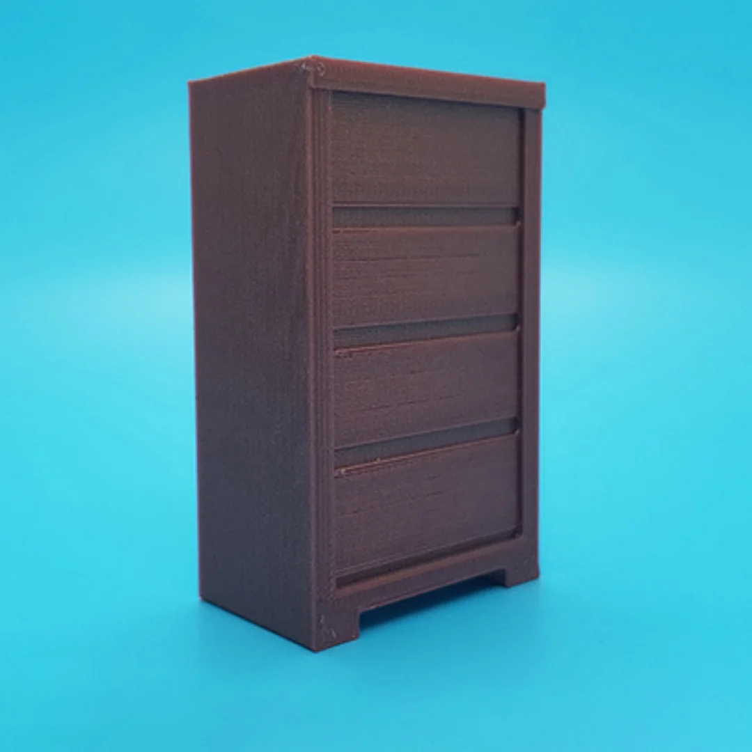 Angled view of the Elegant-7 miniature cabinet at 1:20 scale, showing its panelled front and frame.
