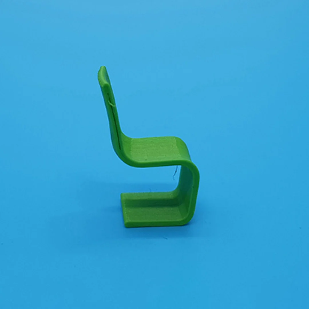 Cantilever Chair miniature model from the side at 1:50 scale.